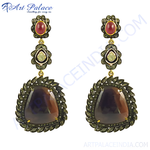 Load image into Gallery viewer, Sapphire and ruby drop earrings in a unique design.
