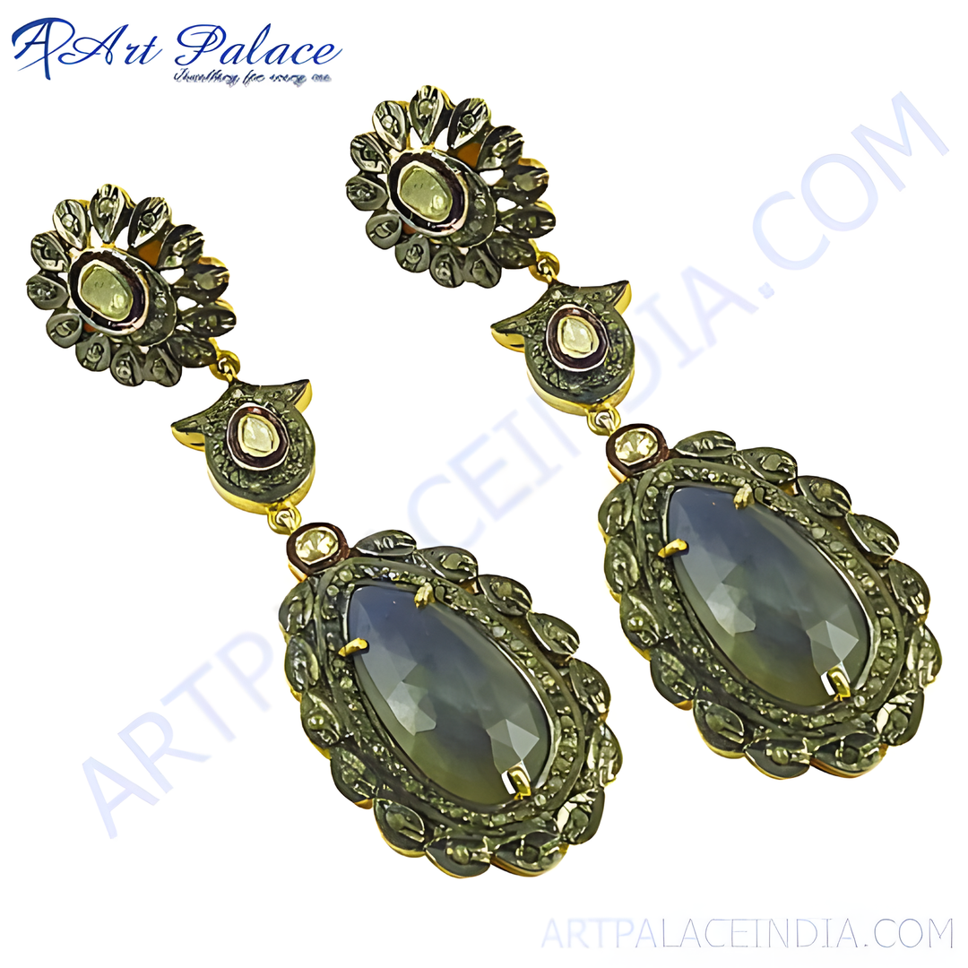 Antique style gemstone drop earrings with detailed metalwork, featuring a central gemstone.