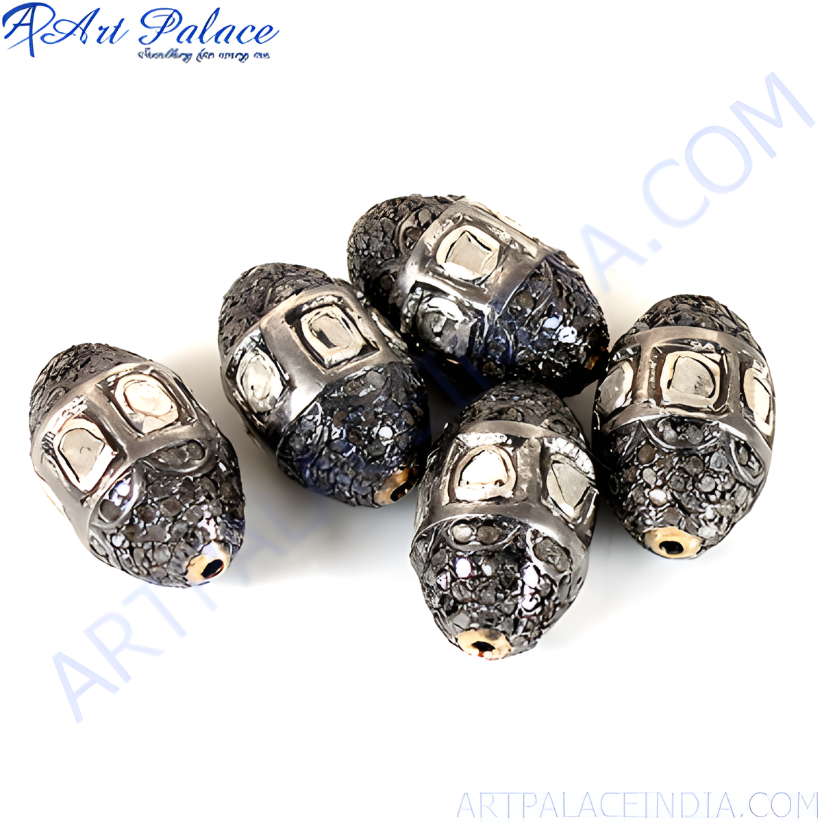 Close up of beaded silver beads with sparkling diamond accents, perfect for jewelry design