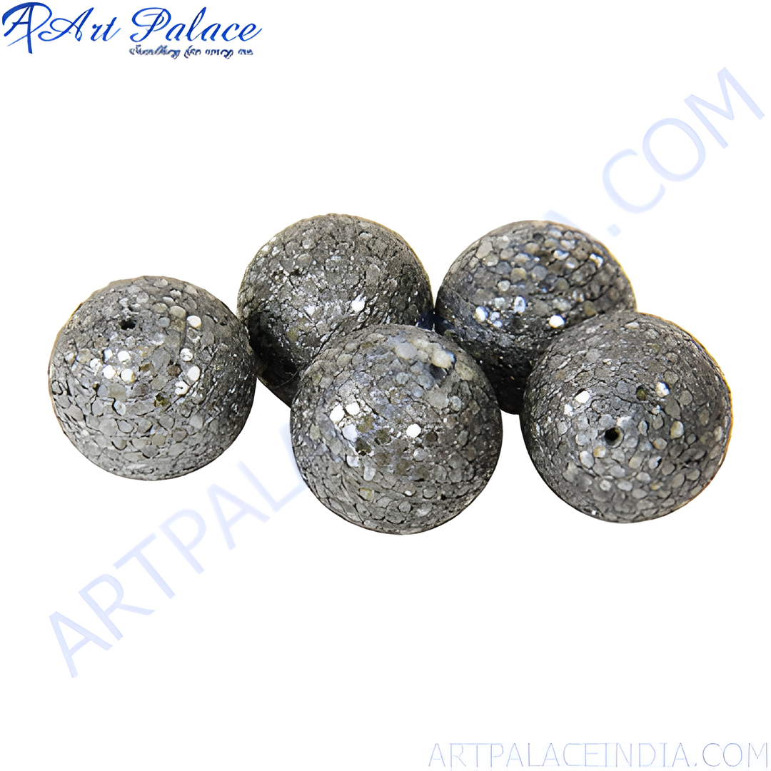 Close-up of a cluster of sparkly stone orb beads for jewelry making, with a textured surface.