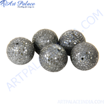 Load image into Gallery viewer, Close-up of a cluster of sparkly stone orb beads for jewelry making, with a textured surface.
