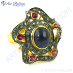 Load image into Gallery viewer, gold plating plated cocktail ring with a large blue sapphire center stone and smaller ruby gemstones.
