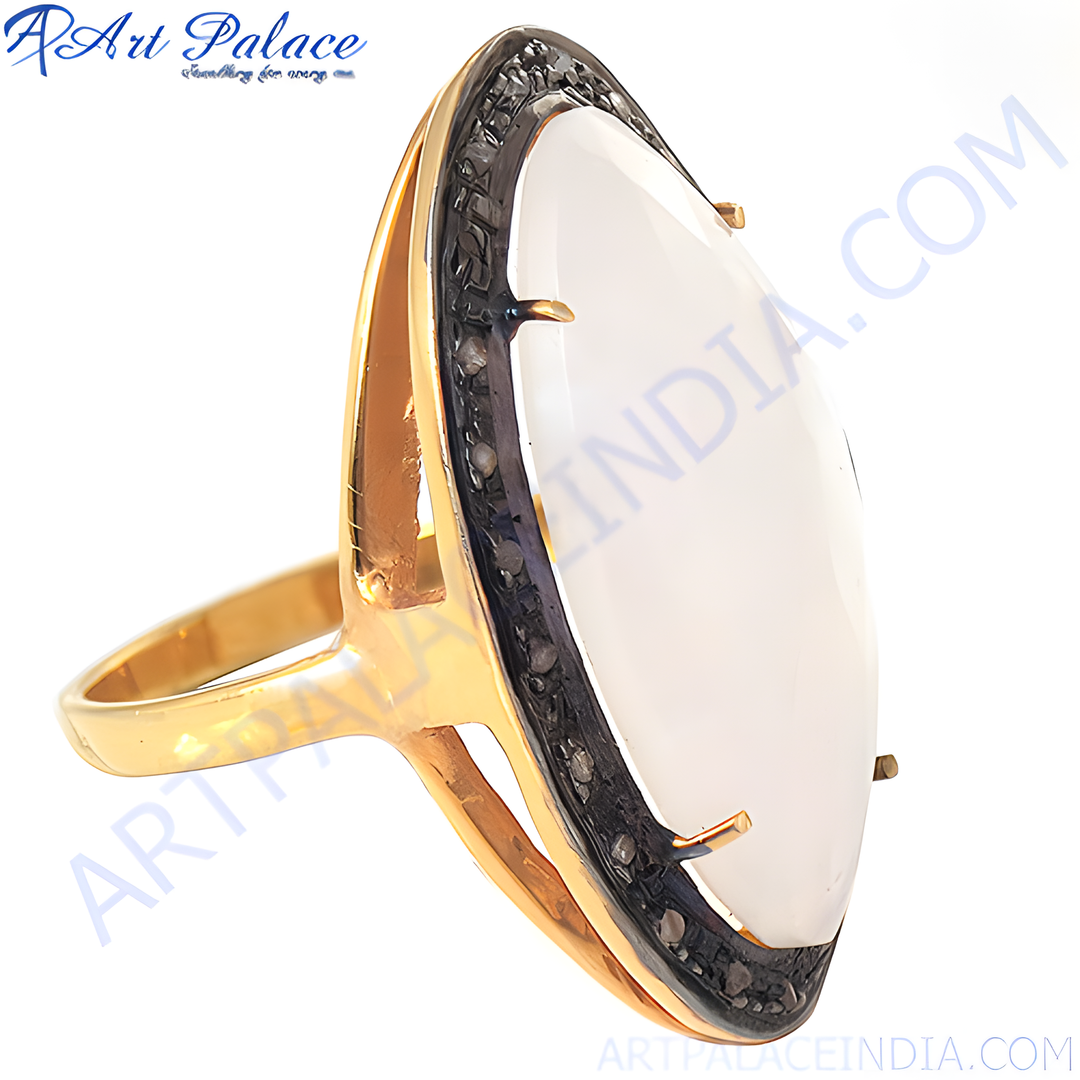 gold plating ring with a large white opal stone and black accents, a stylish statement ring.