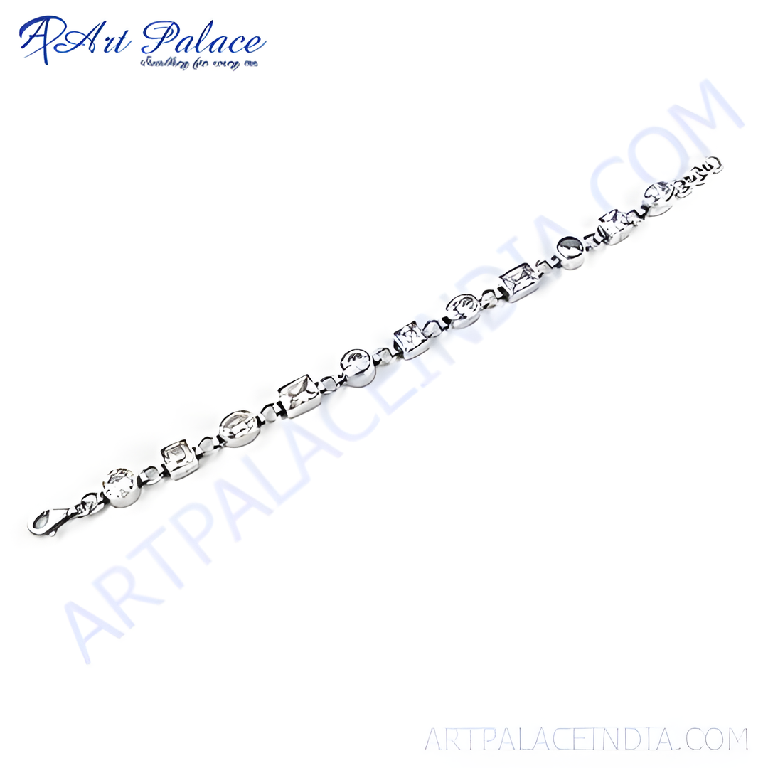 Silver chain bracelet with round and square cut cubic zirconia gemstones on a white background.