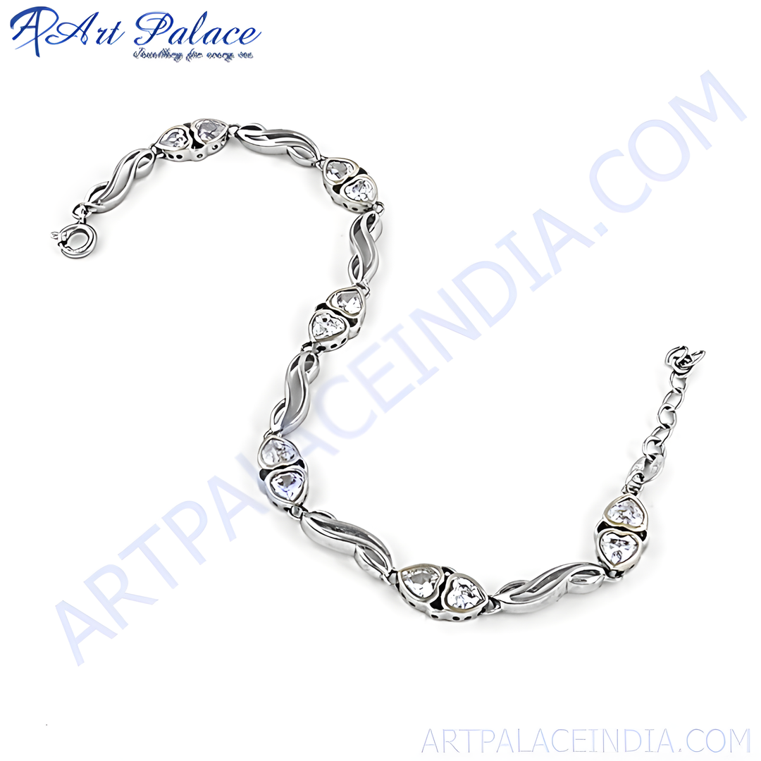 Sterling silver chain bracelet featuring heart-shaped gemstone accents, a beautiful and elegant piece of jewelry for women.
