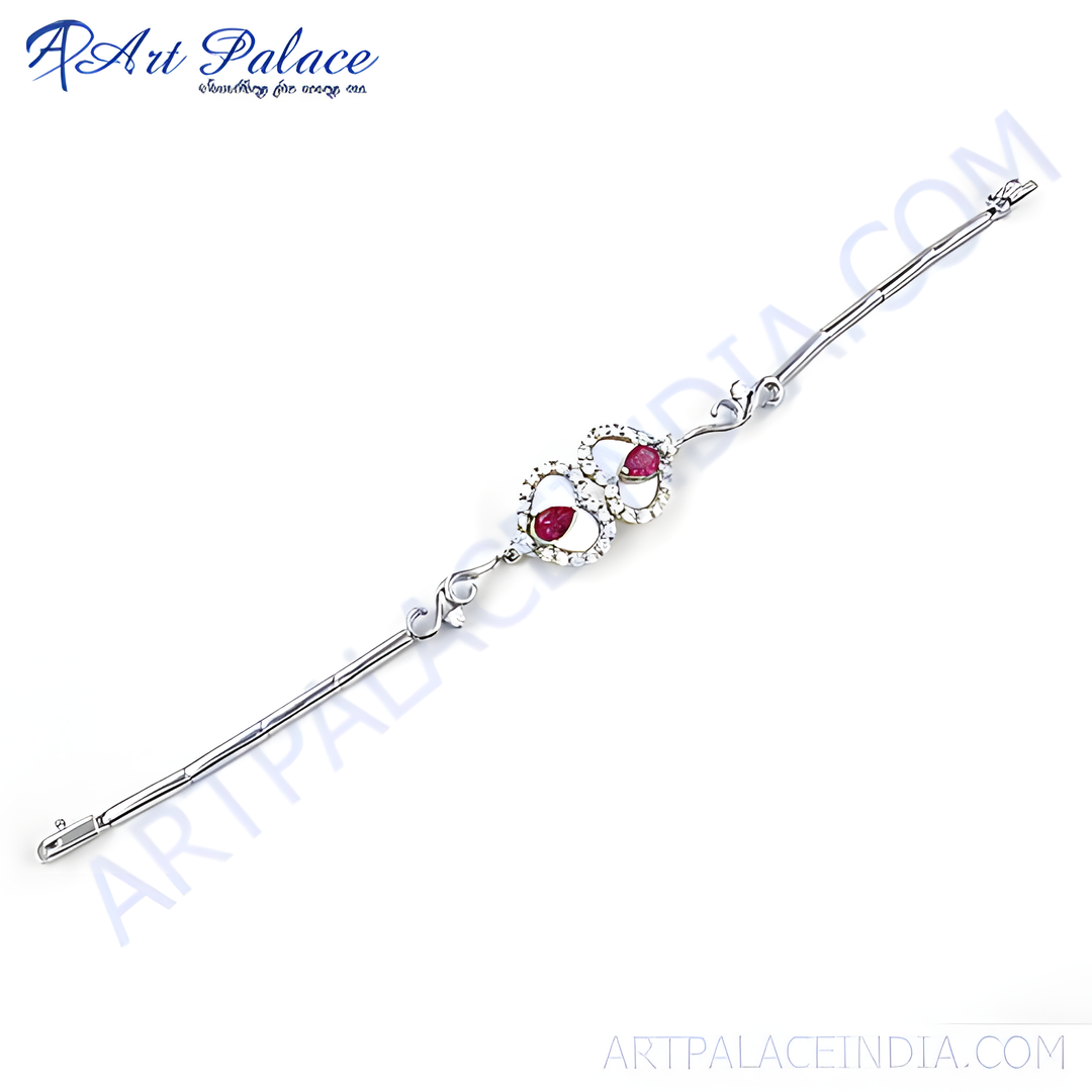 Sterling silver bracelet featuring heart-shaped ruby gemstones. A beautiful and elegant piece of jewelry.