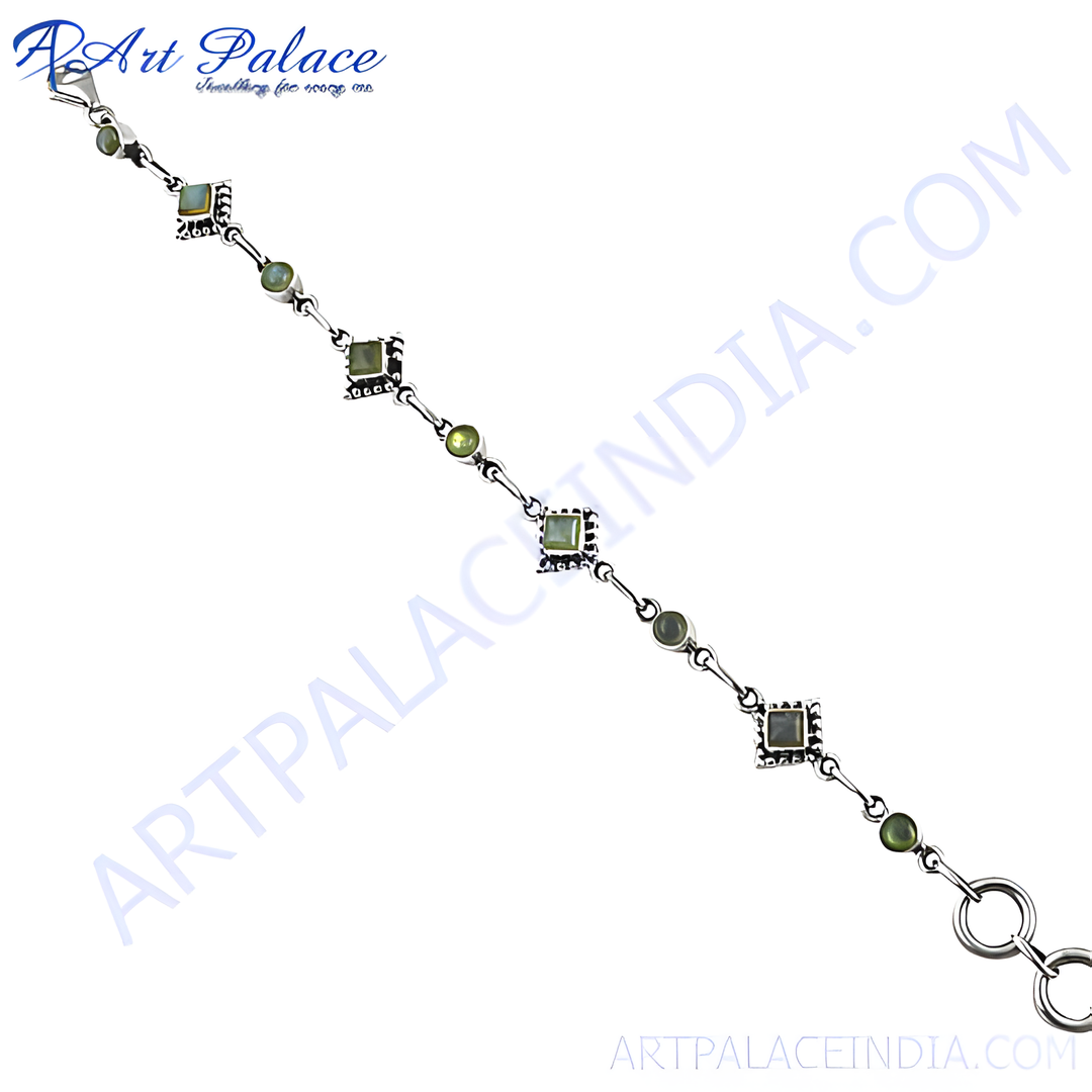 925 sterling silver peridot bracelet with green gemstones and delicate design.