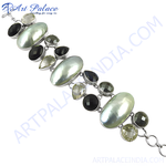 Load image into Gallery viewer, Sterling silver gemstone bracelet with oval pearl and black onyx accents, perfect for adding a touch of elegance to any outfit.
