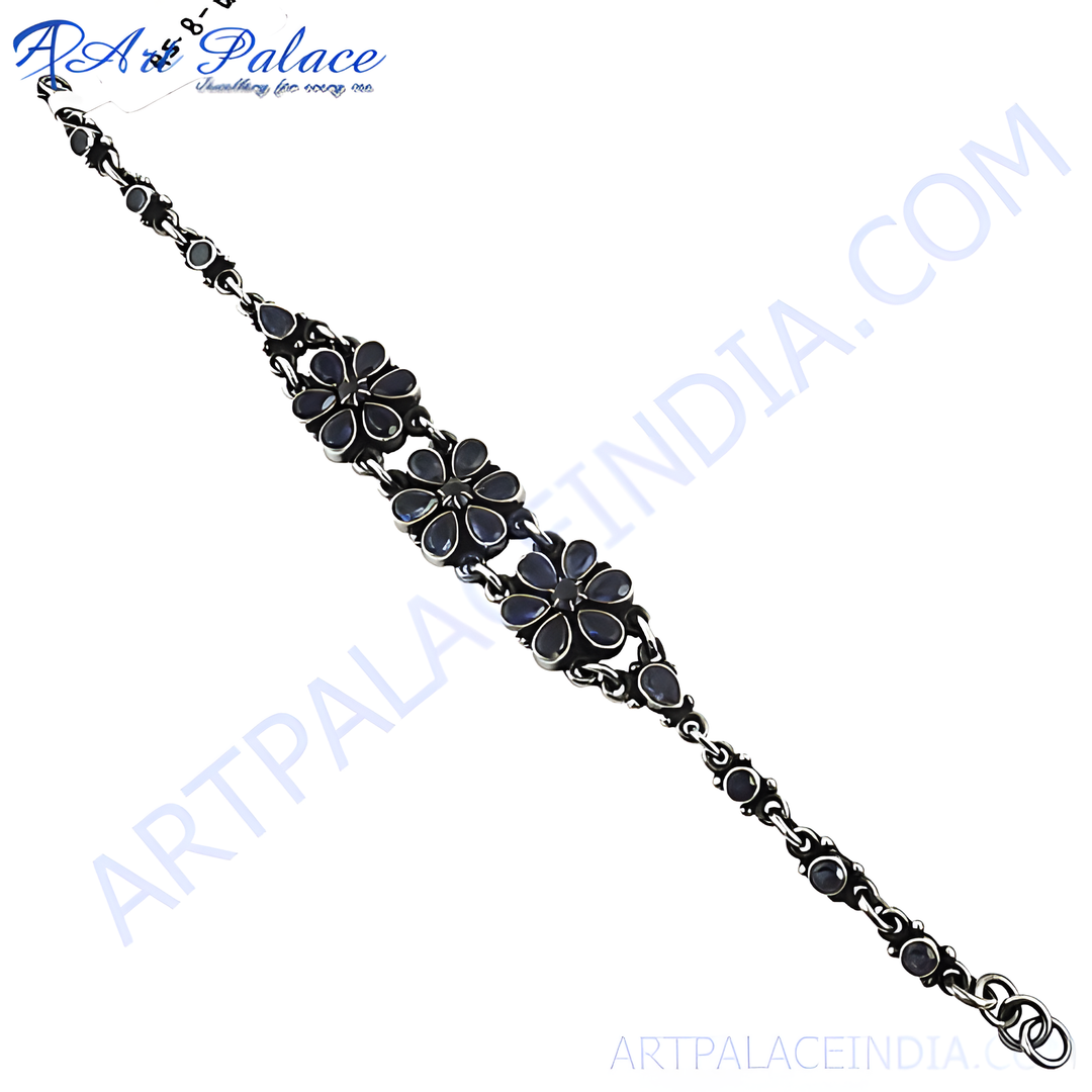 925 sterling silver flower bracelet with dark blue gemstone accents, elegant jewelry for women.
