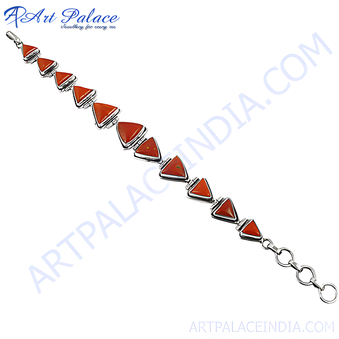 Sterling silver bracelet featuring vibrant red coral triangle stones, perfect for women's jewelry.