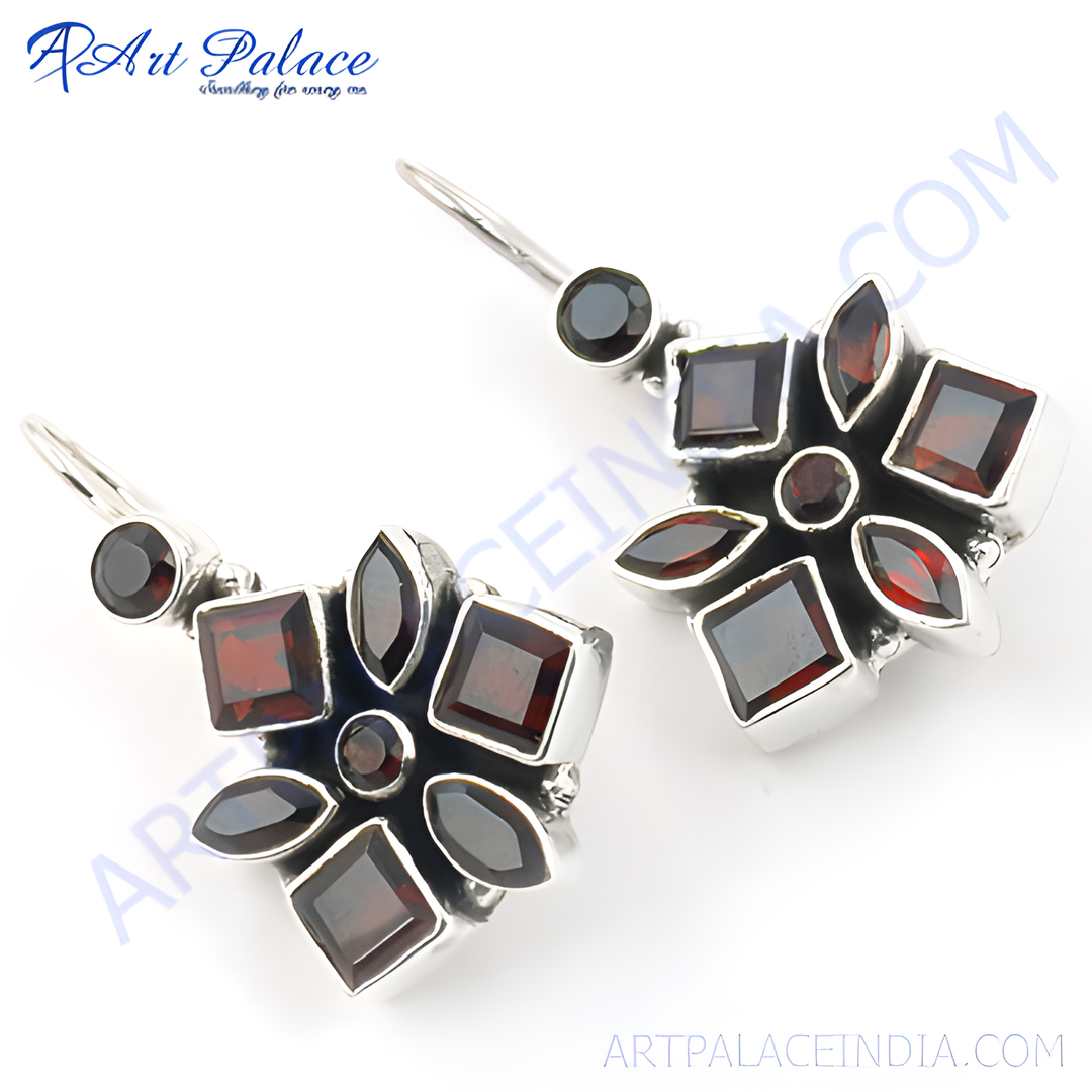 925 sterling silver dangle earrings with red garnet gemstones in a flower design.