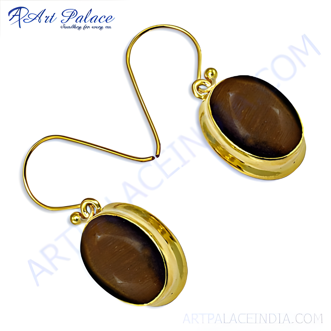 gold plating dangle earrings featuring oval-shaped tiger eye gemstones in a gold plating setting.