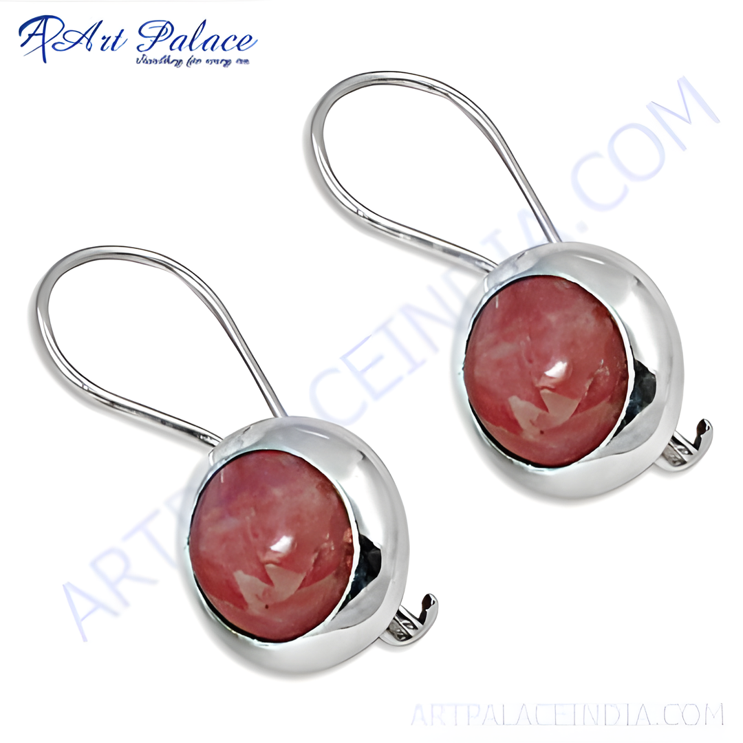 Sterling silver dangle earrings with a round pink gemstone set in a polished bezel, elegant and eye-catching.