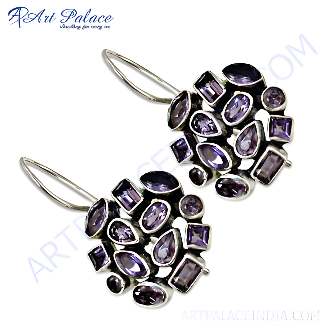 Sterling silver drop earrings with a cluster of various shapes of purple amethyst gemstones. The earrings feature a silver hook closure.