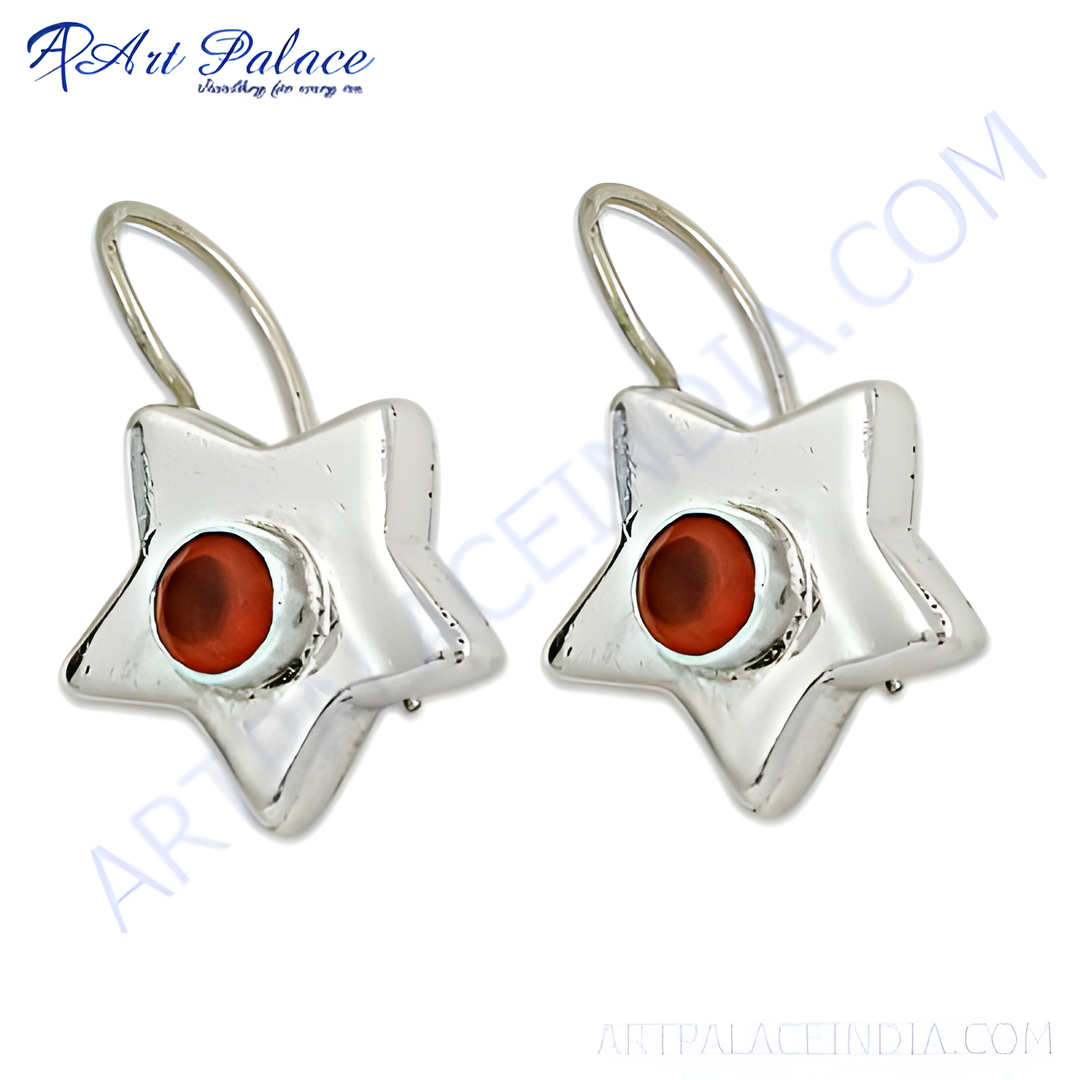 Sterling silver dangle earrings with a star shape and a red gemstone center. Dainty and elegant for women.