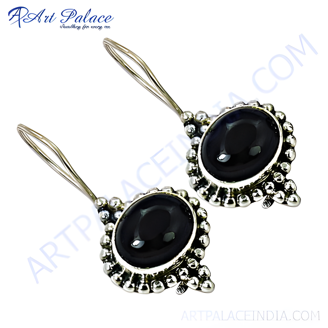 Sterling silver dangle earrings with oval black onyx gemstones, perfect for any occasion.