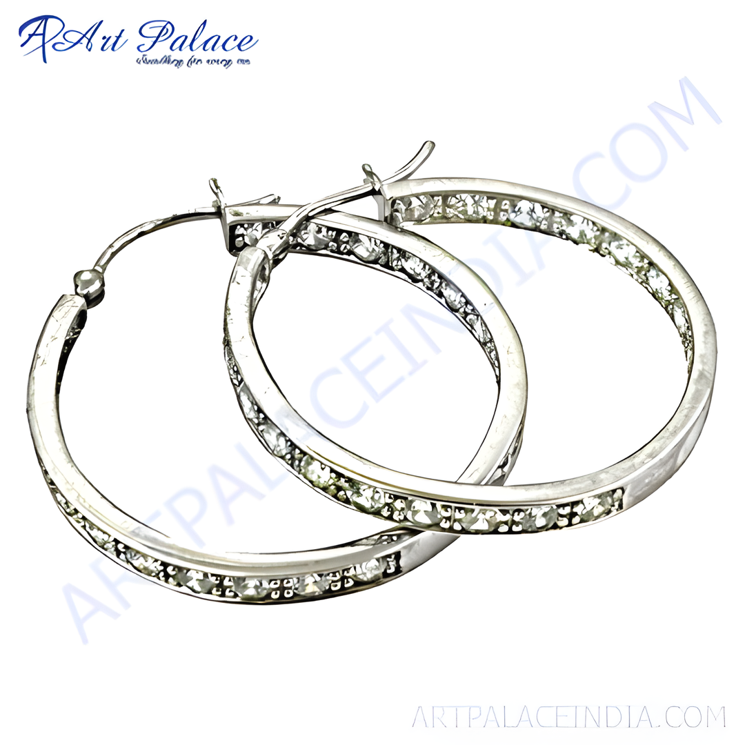 Silver hoop earrings with sparkling clear cubic zirconia stones. Elegant and stylish earrings for women.