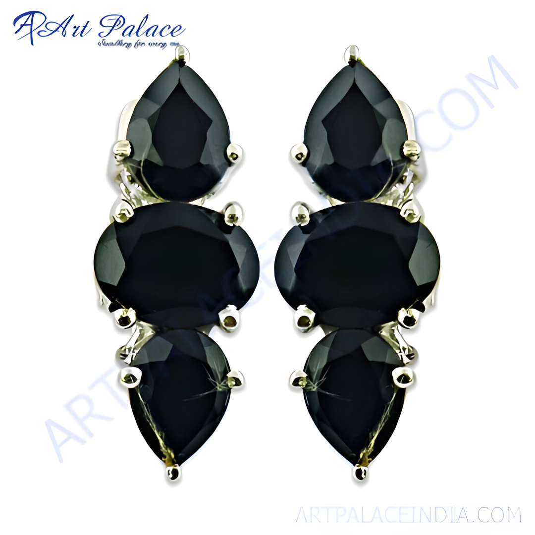 Silver drop earrings featuring black onyx gemstones in a teardrop design.