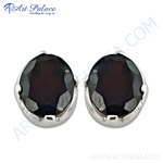 Load image into Gallery viewer, Sterling silver stud earrings with a round dark gemstone center. Elegant and classic design for women.
