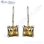 Load image into Gallery viewer, Silver drop earrings featuring princess-cut topaz gemstones. The topaz stones are a warm brown color.
