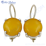 Load image into Gallery viewer, Silver drop earrings with round, yellow amber gemstones and hook closures.
