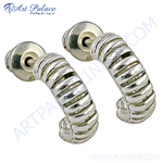 Load image into Gallery viewer, Silver hoop earrings with a twisted design, perfect for women&#39;s daily wear.
