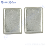 Load image into Gallery viewer, Silver rectangular stud earrings on a white background, showcasing the smooth, polished surface.

