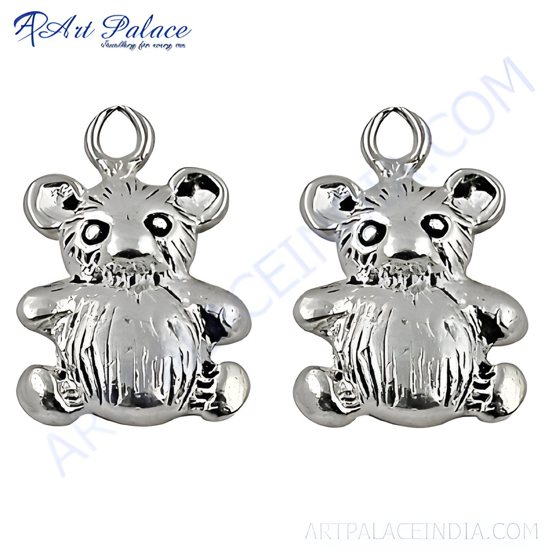 Silver teddy bear charm pendant for jewelry making on a white background. Highly detailed silver bear.