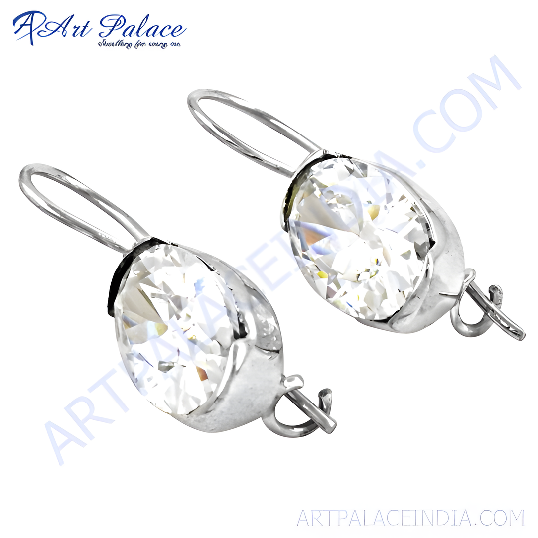 Silver drop earrings featuring oval-cut clear crystal gemstones.