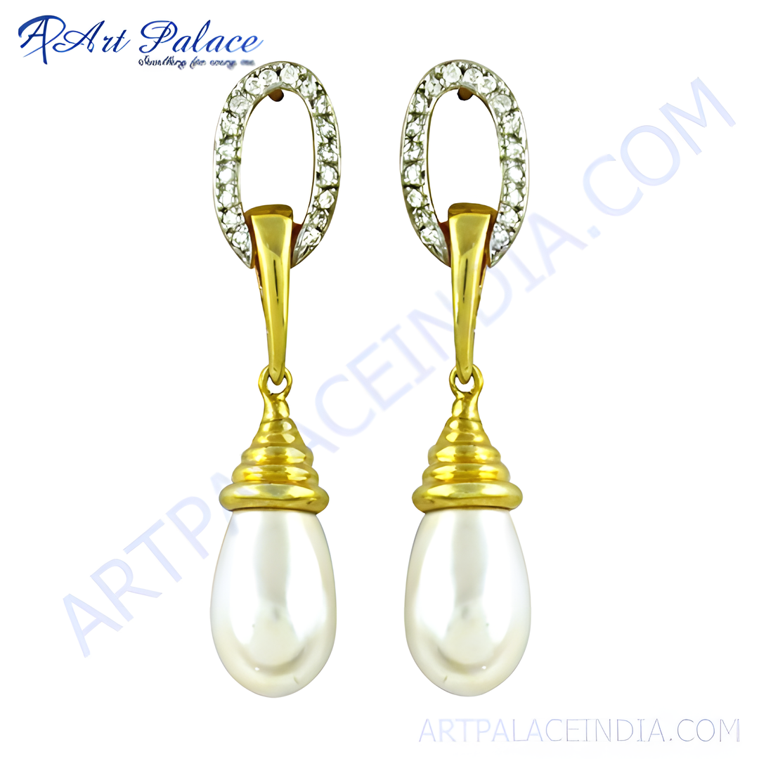 gold plating drop earrings with white pearl drops and a diamond-like accent on top.