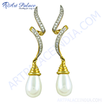 Load image into Gallery viewer, gold plating drop earrings with pear-shaped pearls and diamond accents on a white background.
