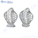 Load image into Gallery viewer, Diamond stud earrings in white metal, featuring sparkling round and baguette-cut diamonds, for women.
