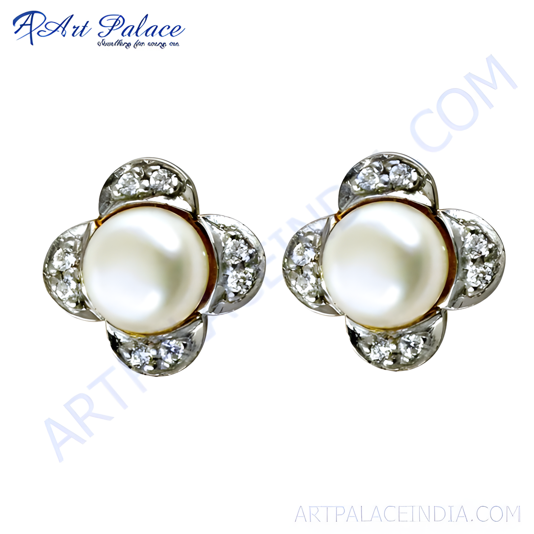 Pearl and diamond stud earrings with a clover design, set in a silver metal.