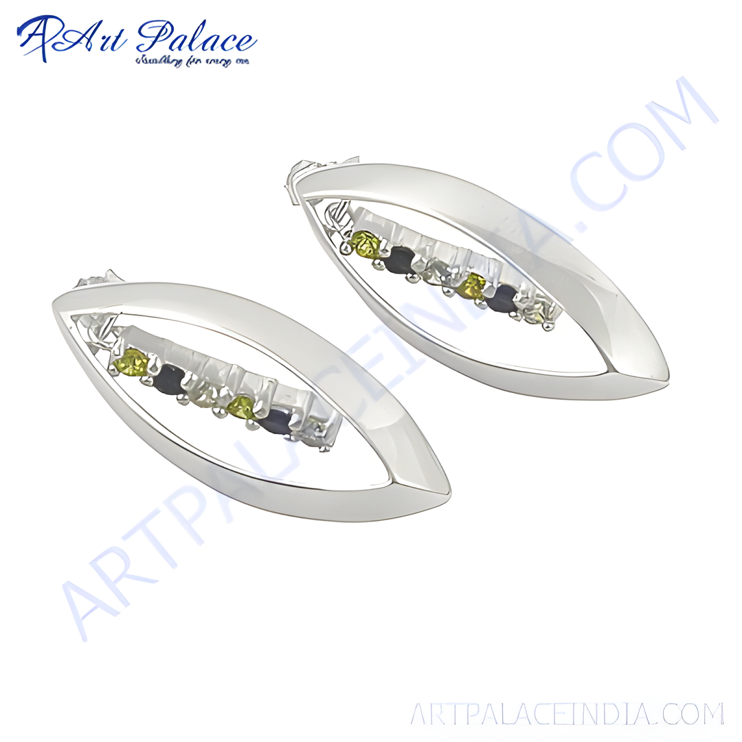 Silver leaf shaped stud earrings with a line of green and black stones, showcasing a sleek and modern design.