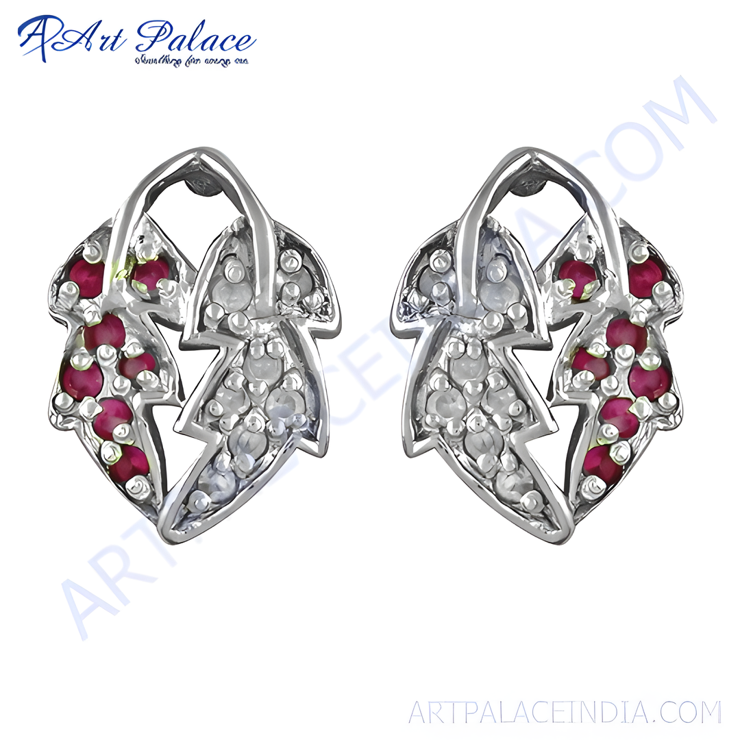 Sterling silver leaf stud earrings featuring ruby gemstones and diamond accents. Elegant and stylish earrings for women.