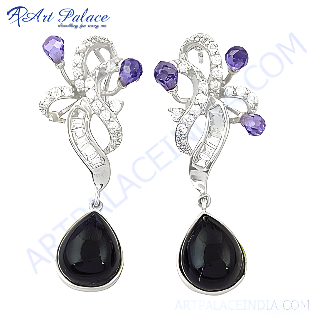 Sterling silver dangle earrings with black teardrop onyx gemstones and purple accents on white background.