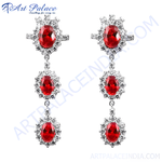 Load image into Gallery viewer, Silver drop earrings featuring vibrant red ruby gemstones.
