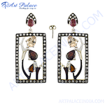 Load image into Gallery viewer, Rectangular drop earrings with gemstone accents and a black frame.
