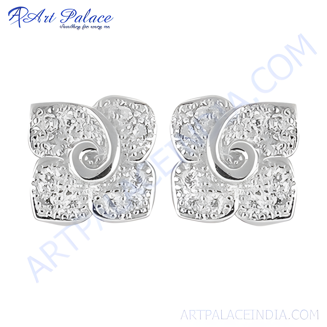 Silver stud earrings with clear cubic zirconia stones in a unique floral design.