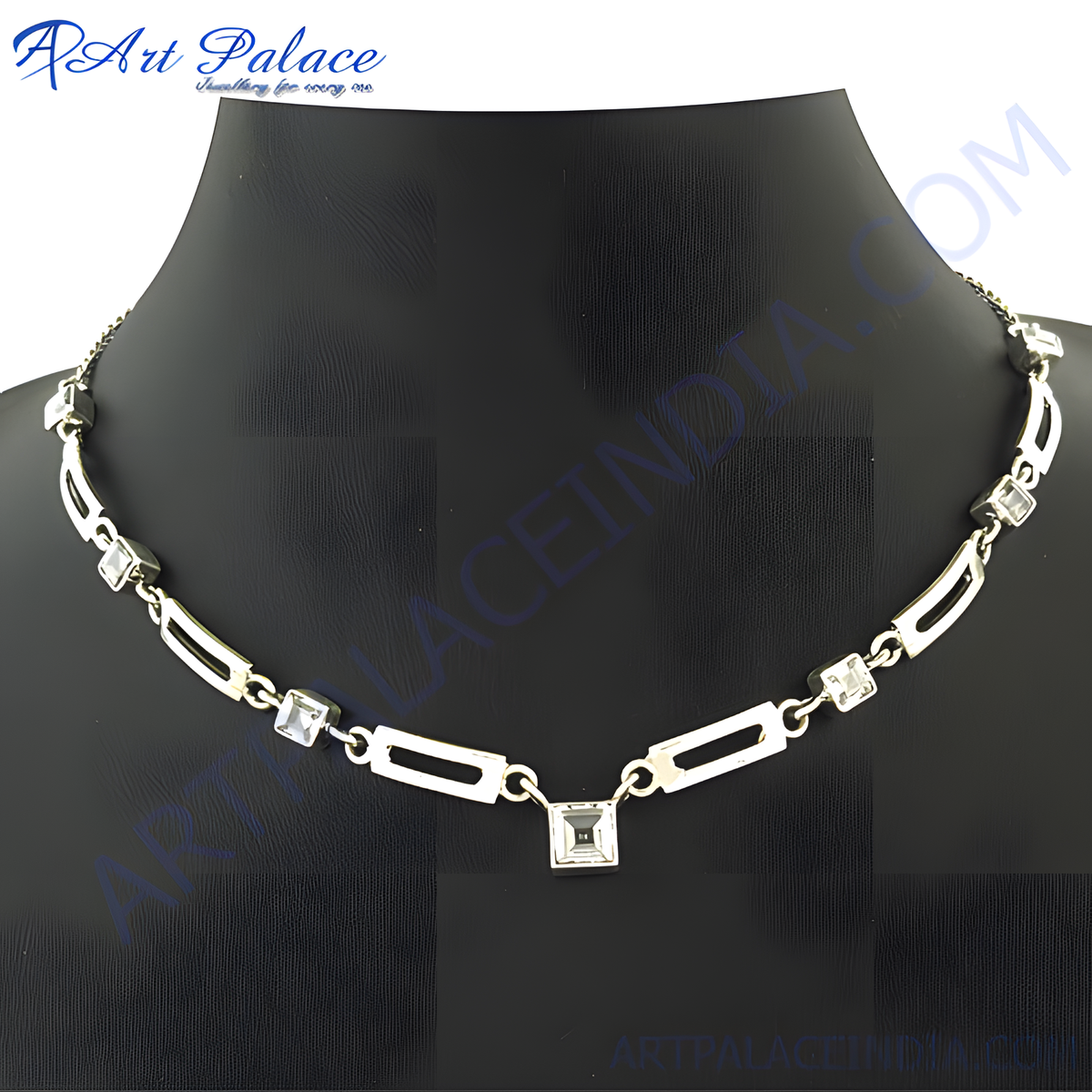 Silver necklace with square cubic zirconia stones displayed on a black neck form