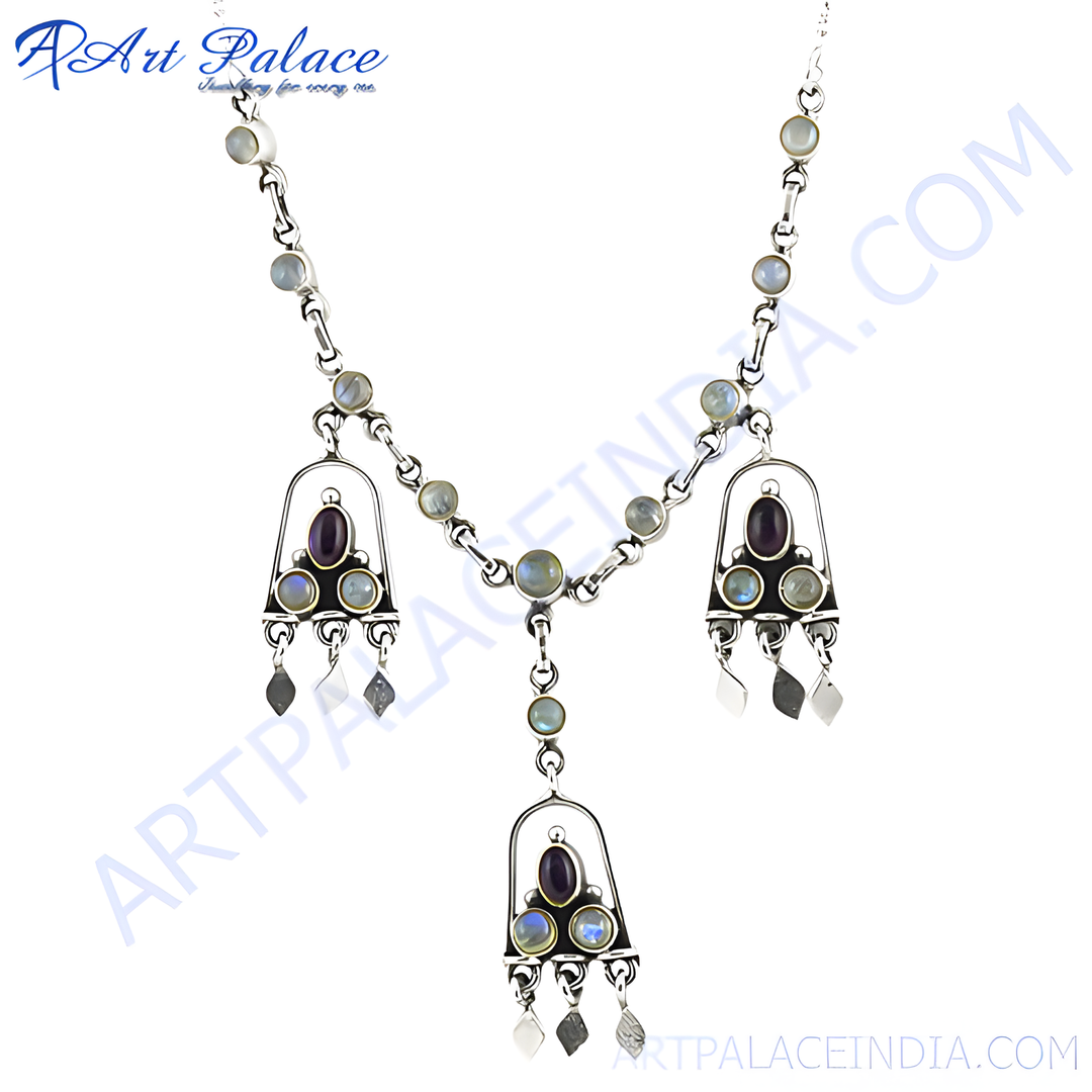 Sterling silver moonstone pendant necklace with a detailed design. Features a central amethyst stone and multiple moonstone accents.