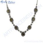 Load image into Gallery viewer, 925 sterling silver necklace featuring olive green gemstones in a linked design.
