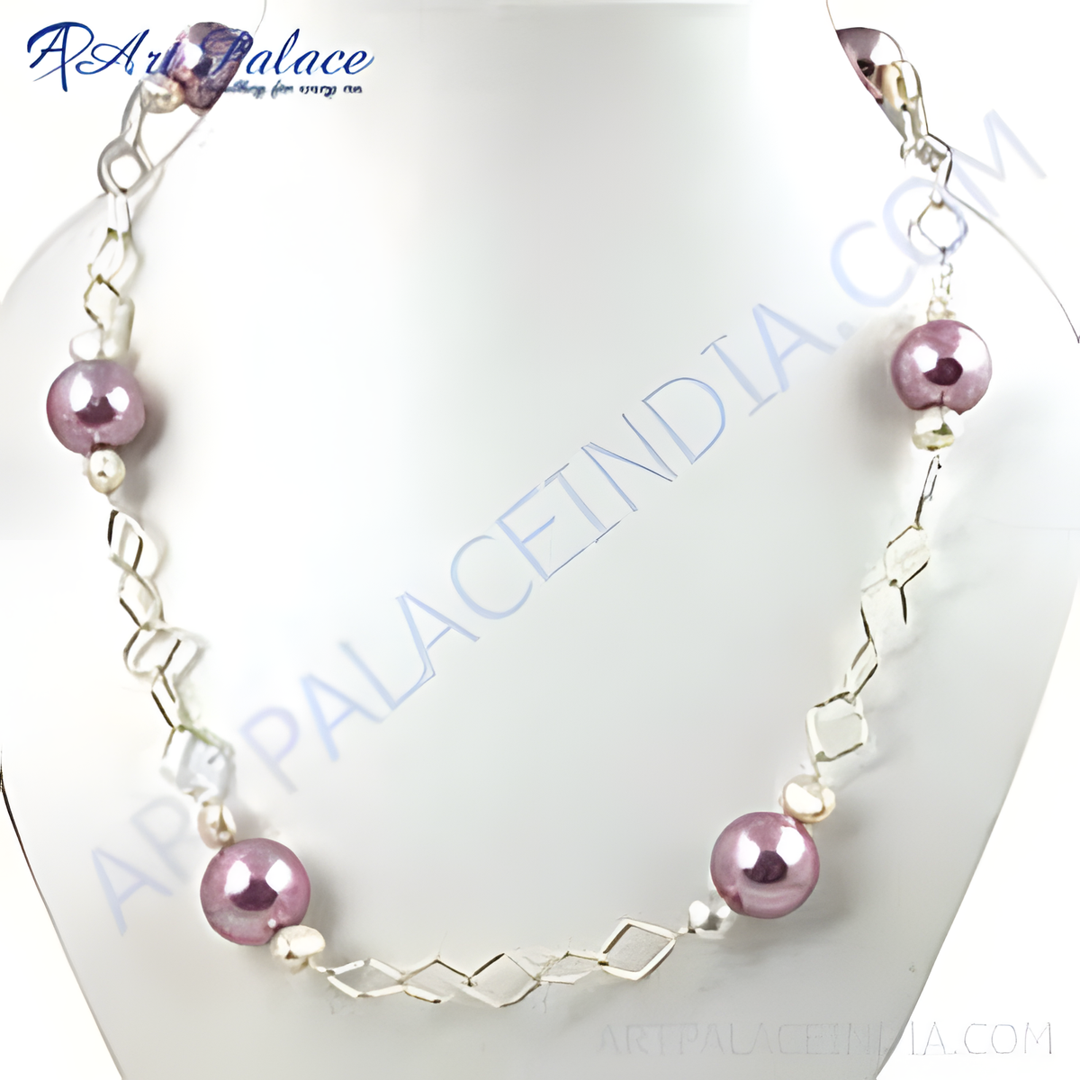 A pearl and silver fashion necklace displayed on a white bust, showing the detail of the necklace