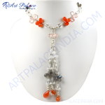 Load image into Gallery viewer, A stunning gemstone flower necklace featuring orange and pink beads with crystal accents, displayed on a white jewelry bust.
