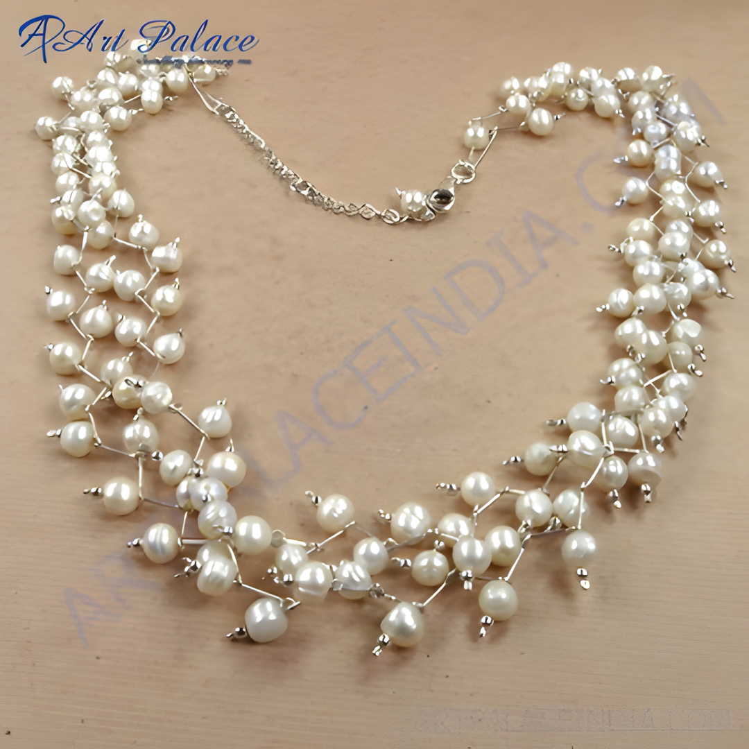 Sterling silver pearl cluster necklace featuring freshwater pearls and a delicate silver chain design.