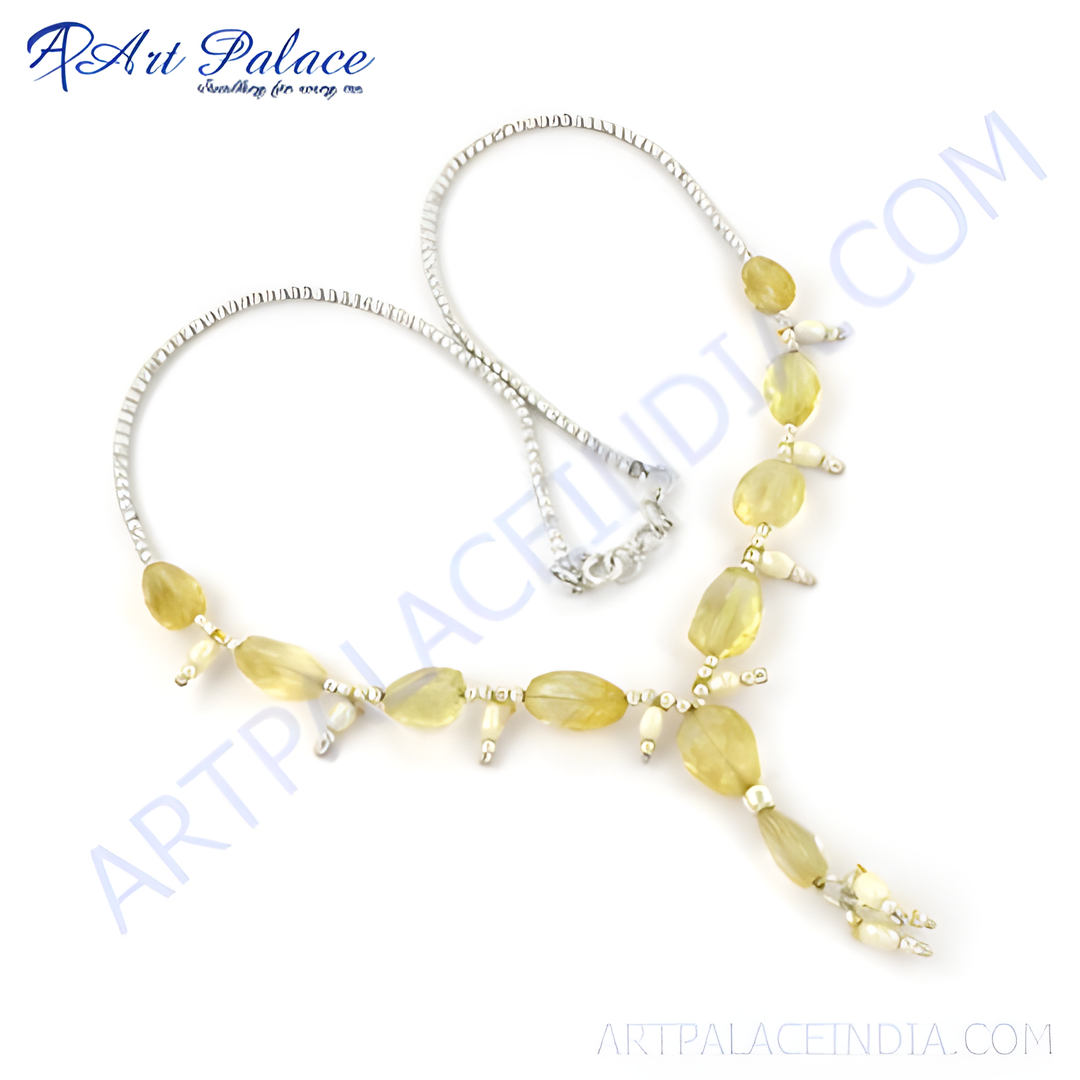 Elegant silver necklace with oval-cut citrine gemstones and pearl accents on a white background.