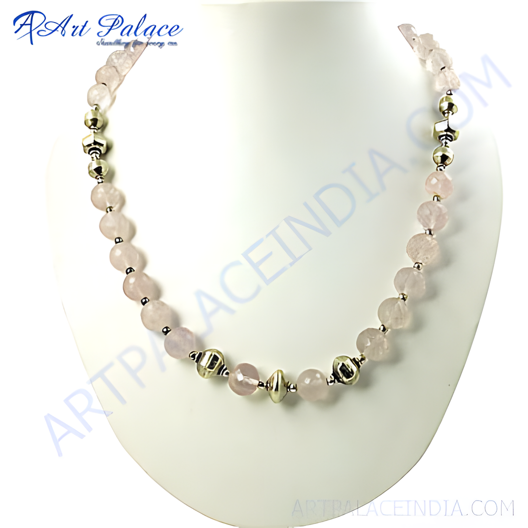 Rose quartz bead necklace with silver accents, a delicate and elegant piece of jewelry.