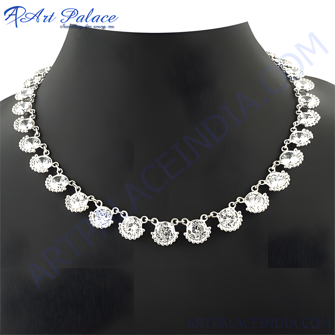 Silver necklace with sparkling cubic zirconia gemstones on a black mannequin