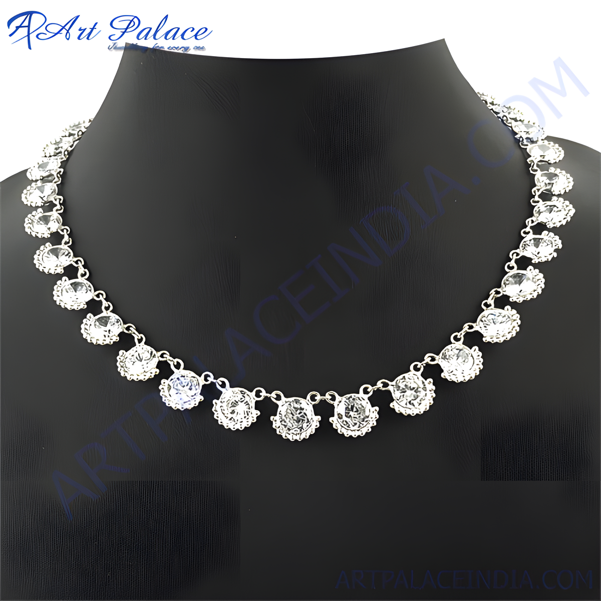 Silver necklace with sparkling cubic zirconia gemstones on a black mannequin
