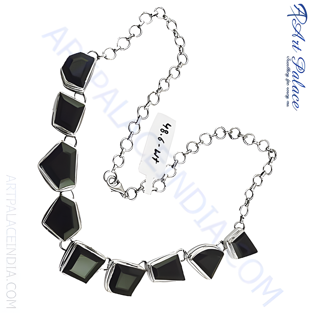 Sterling silver geometric necklace with multiple black onyx gemstones.